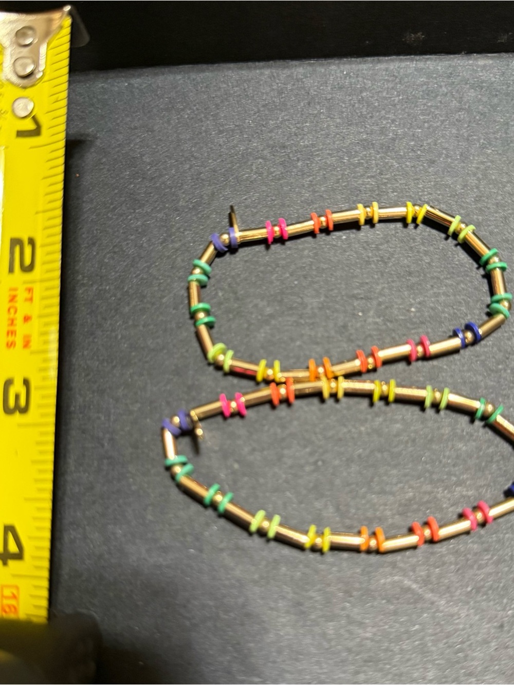 Neon colors and gold stretchy bracelets.